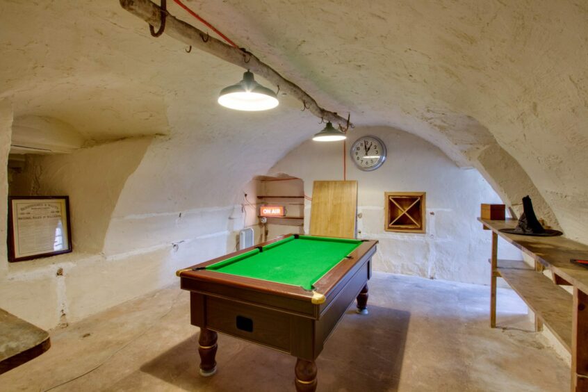 Games room with pool table inside Balbegno Castle, Fettercairn.