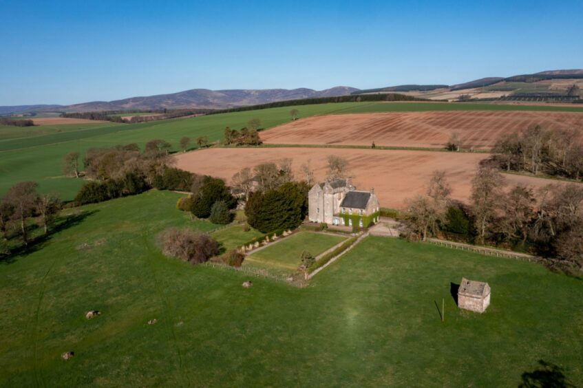 Aerial view of Balbegno Castle and surrounding Kincardineshire countryside.
