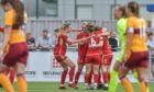 Aberdeen Women celebrate after Bayley Hutchison's opening goal against Motherwell.