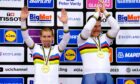 Great Britain's Neil Fachie (left) and Matt Rotherham celebrate on the podium after winning gold in the men's B 1km time trial final during day two of the 2023 UCI Cycling World Championships at the Sir Chris Hoy Velodrome, Glasgow. Image: PA.
