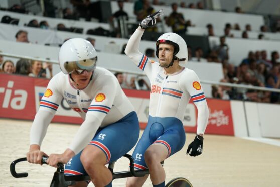 Great Britain's Neil Fachie celebrates with pilot Matthew Rotherham after winning gold in the Mixed B Team Sprint. Image: PA