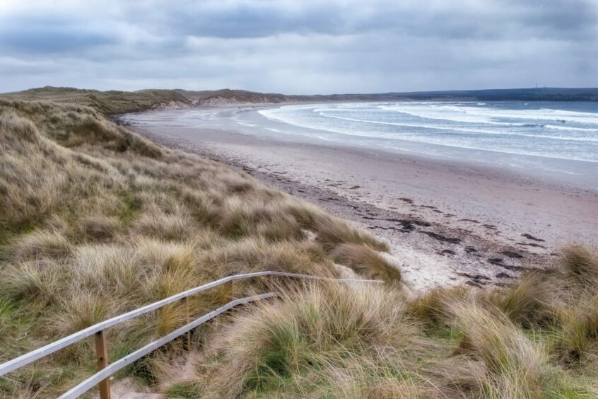 Dunnet Bay beach with walkway in the foreground. 