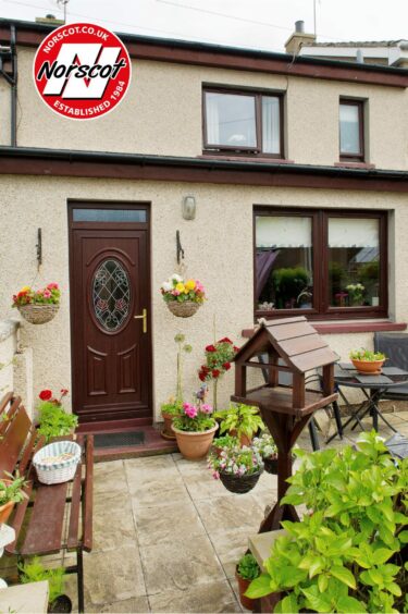 facade of a home with Norscot windows and front door