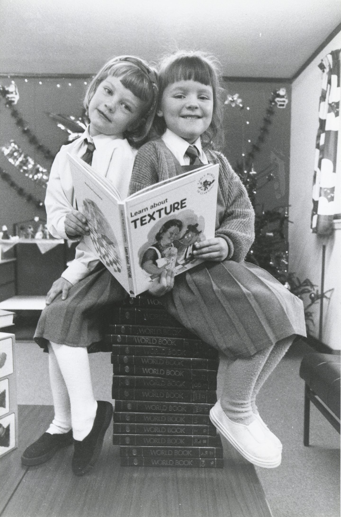 Two pupils of Danestone Primary School, Rachael Douglas and Elaine Duncan, with some of the £1,800 worth of books which the school won in the Partners in Excellence scheme in 1992.