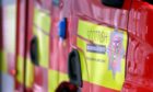 Stock image of red SFRS appliance zoomed in on logo. Fire crews were called to a shed fire in Bucksburn.