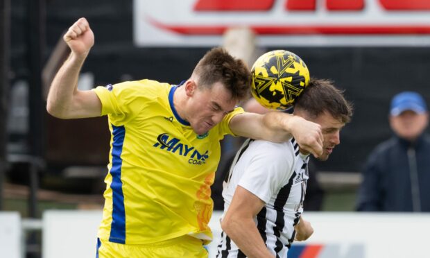 Buckie Thistle's Jack Murray, left, and Fraserburgh's Ryan Sargent battle for a header