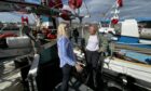 Environment Minister Gillian Martin, right, on a visit to Peterhead to discuss new technology being rolled out across the Scottish fishing fleet.