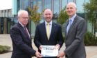 HIE chairman Alistair Dodds, Wellbeing Economy Secretary Neil Gray and HIE chief executive with a copy of HIE's new strategy for creating economic prosperity in the north