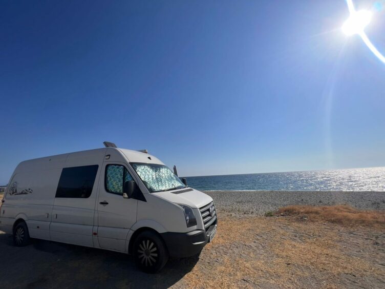 Van parked at the beach