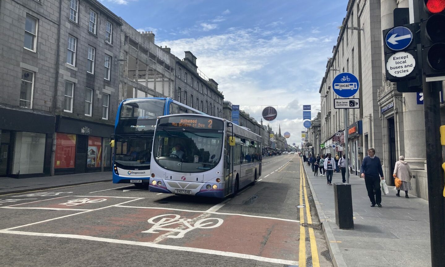 Cars and buses driving through the new bus gates on Union Street.