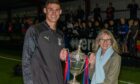 Inverness provost Glynis Campbell-Sinclair presents the Inverness Cup to Caley Thistle defender Wallace Duffy. Image: Jasperimages