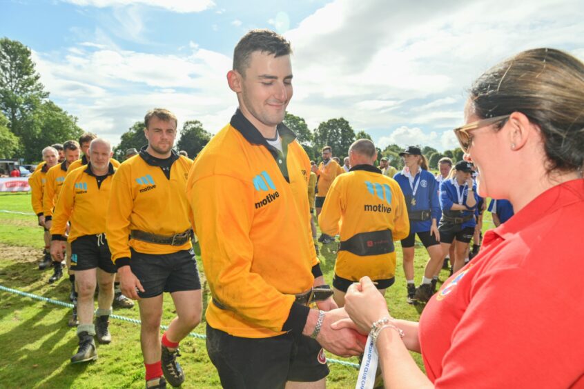 Cornhill pick up their gold medals.