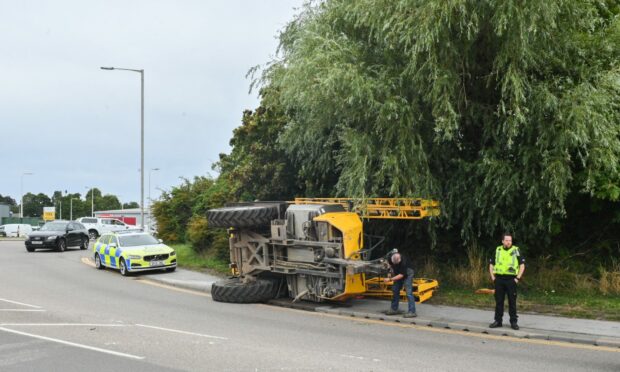 A trailer has landed on its side on the A96. Image: Jason Hedges/DC Thomson