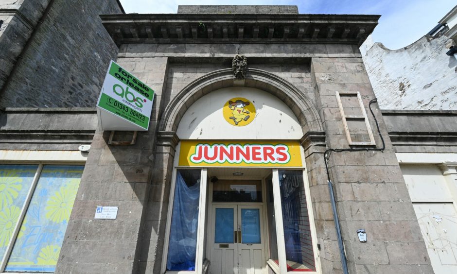 Looking up at front door of former Junners toy shop in Elgin.