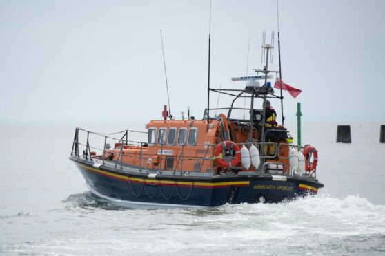 RNLI Arbroath were called to assist after a boat overturned near the harbour. Image: Kim Cessford / DC Thomson
