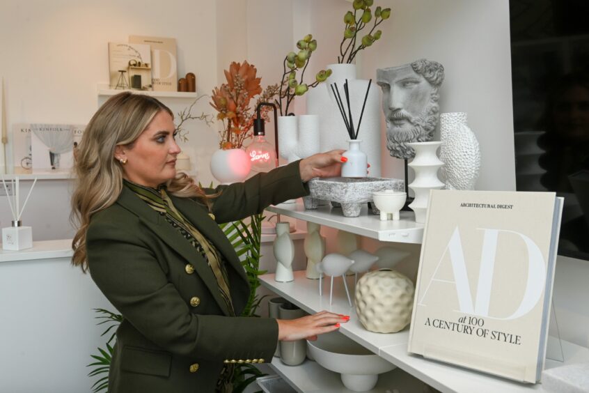 Pictured: Nikki in arranging stock in Westholme Interiors. 