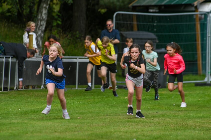 Young girls racing at Ballater Highland Games 2023