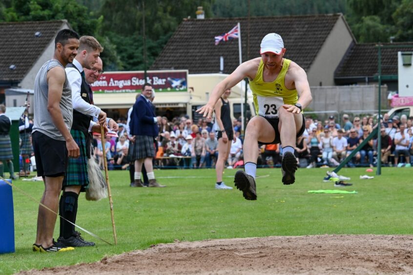 A man doing the long jump during Ballater Highland Games 2023