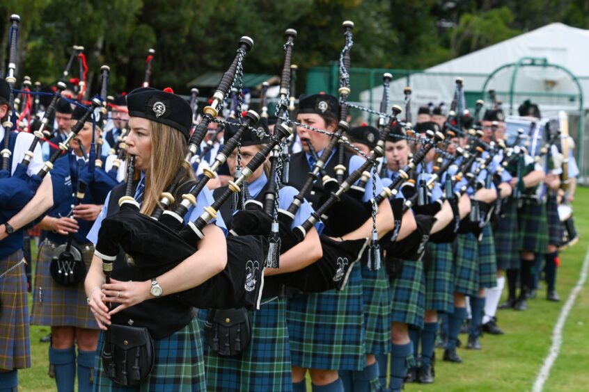 The pipe band playing at Ballater Highland Games 2023