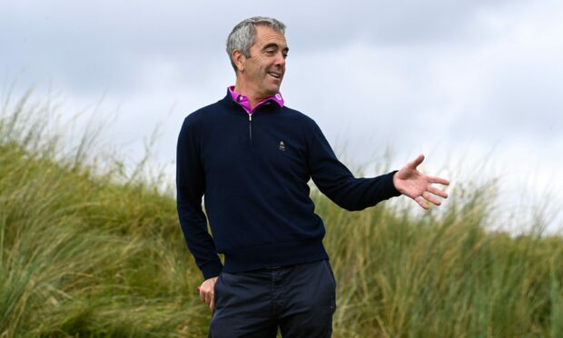 James Nesbitt waits for someone to hand him a club, or a drink, we don't really know, at Trump International Golf Links. 
Image: Kenny Elrick/DC Thomson.