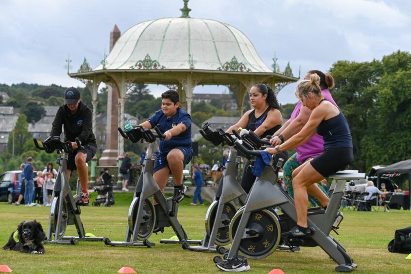 Exercise enthusiasts trying out the exercise bikes at the event. 