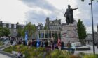 Crowds gathered at the Union Terrace Gardens William Wallace statue.