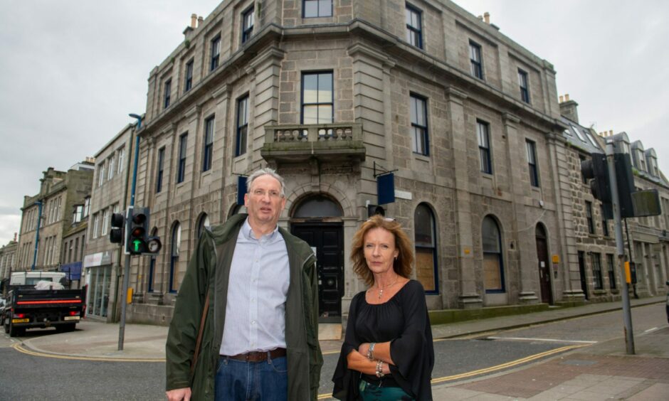 Paul Higson and Esther Slater standing outside the former Clydesdale bank in Fraserburgh.