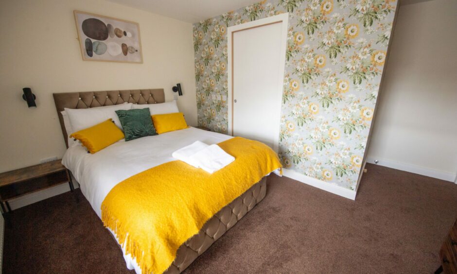 One of the bedrooms at the Stag and Thistle hotel, which is located at the former John Trail bookshop.