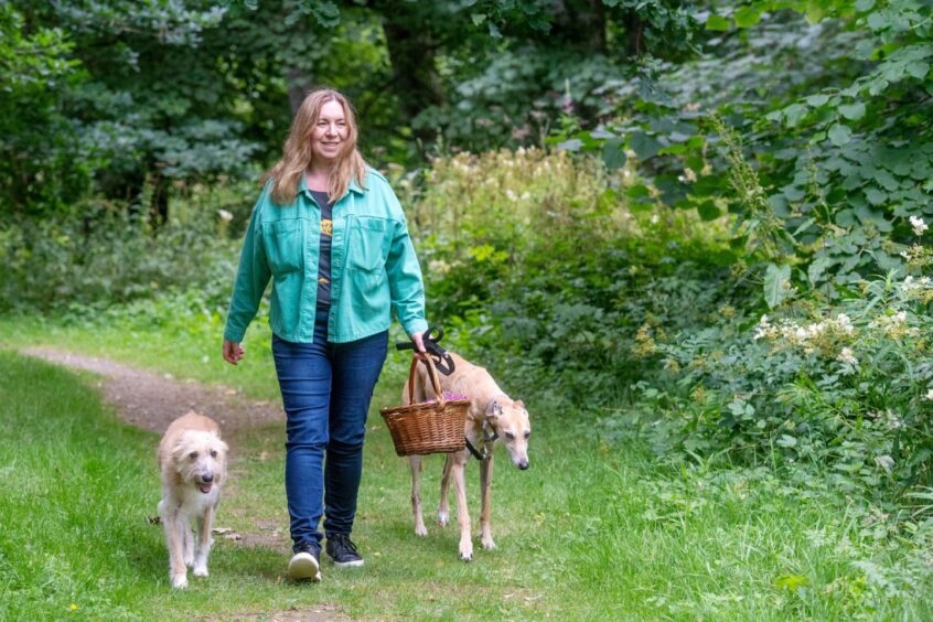 Leanne out foraging with her two dogs.