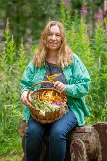 Leanne Townsend with a basket of foraged wild foods in Alford.
