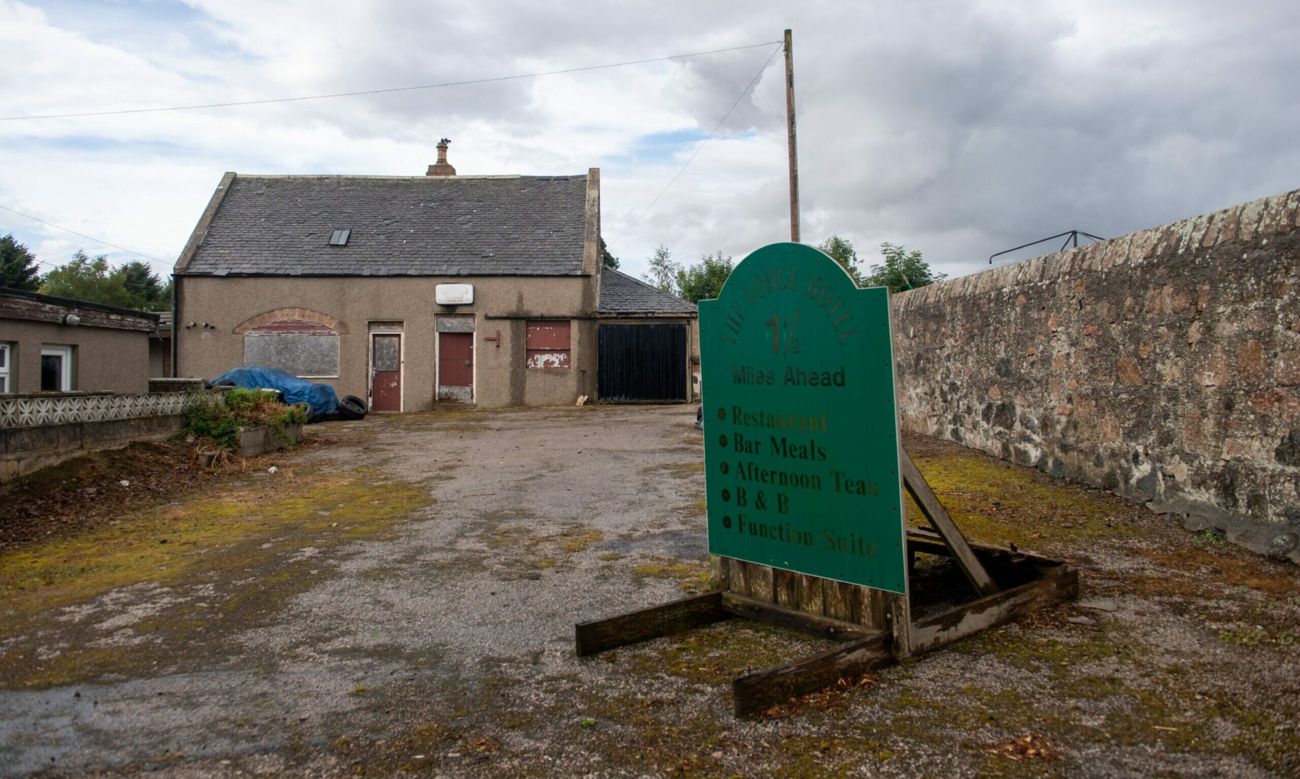 The old Lodge Hotel sign remains in place despite the Old Rayne hotel demolition plans 