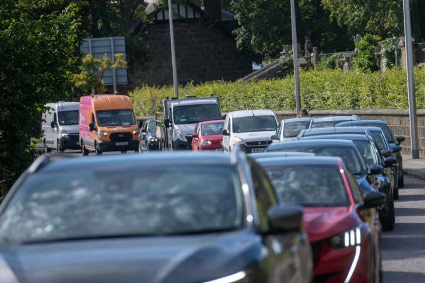 Cars in traffic due to roadworks.