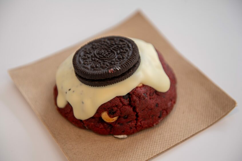 A red velvet cookie with an Oreo on top