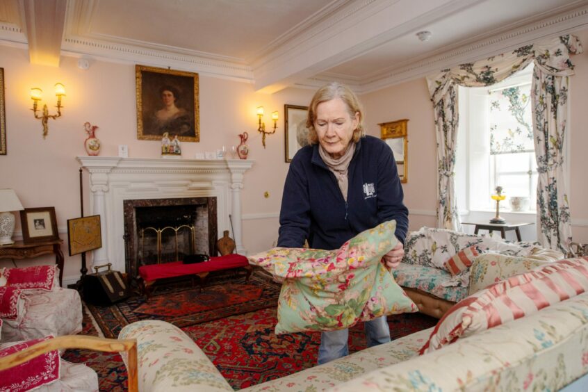 Volunteer Sheila Anderson in the castle's drawing room. 