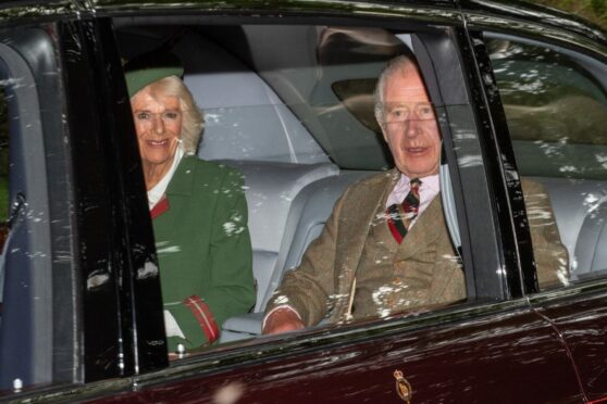 King Charles and Queen Camilla arriving at Crathie Kirk on his first visit to the church since he became King. Image: Kami Thomson/DC Thomson