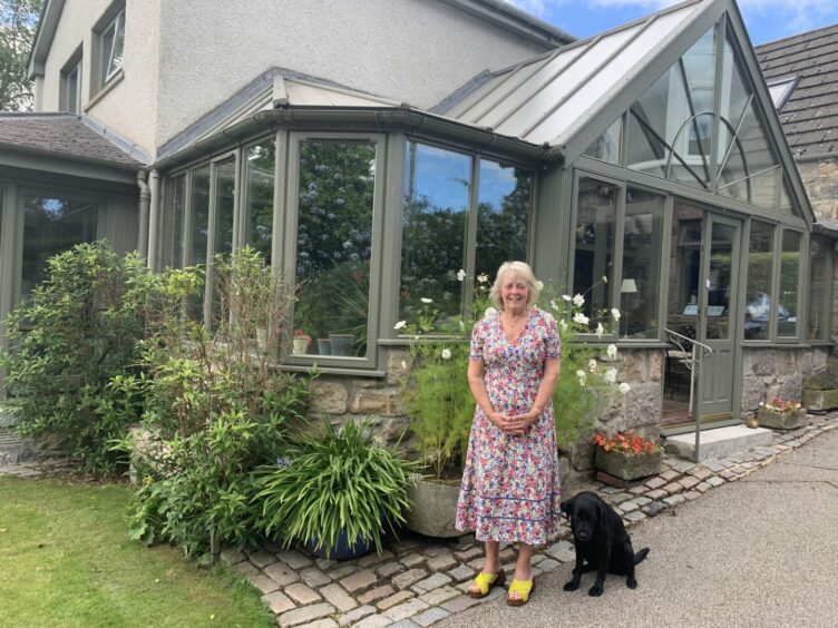 Elizabeth Mitchell stands in front of Lofthillock, a four-bedroom house in Inverurie.