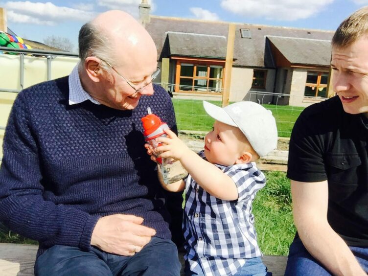 Maurice Jones and his grandson