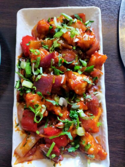 Delhi chicken on a rectangular plate