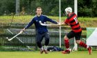 Oban's Malcolm Clark scoring against Lovat keeper Stuart Macdonald. Image: Neil Paterson.