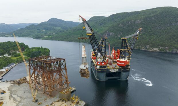 The Brae Bravo upper jacket and Brae Alpha drilling rig arrive at AF Decom's yard in Norway.