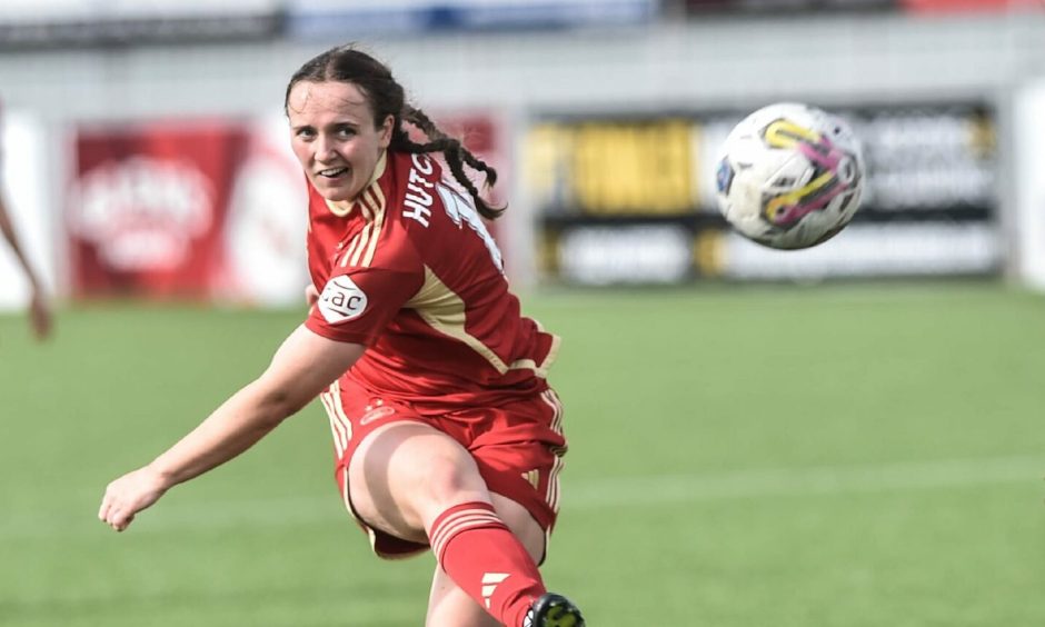 Aberdeen forward Bayley Hutchison gets a shot away in the match against Motherwell.