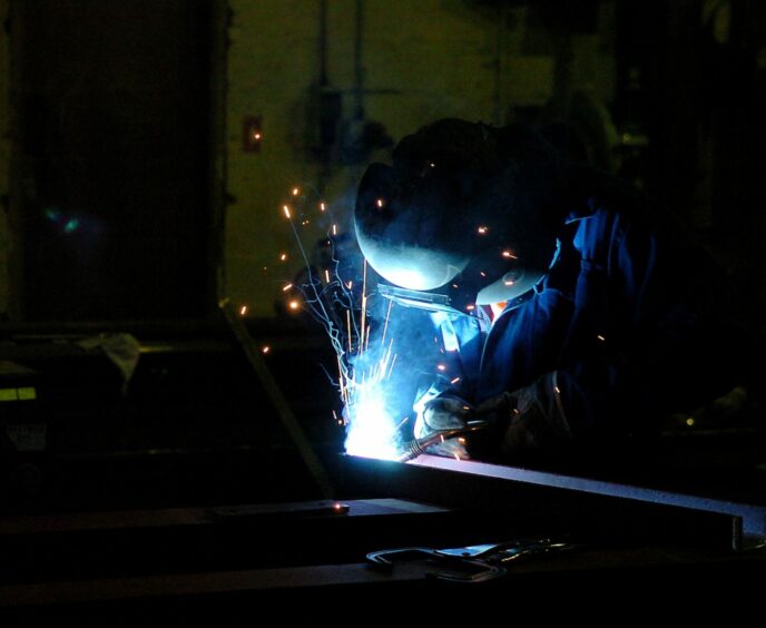 An RSE machine shop welder. 