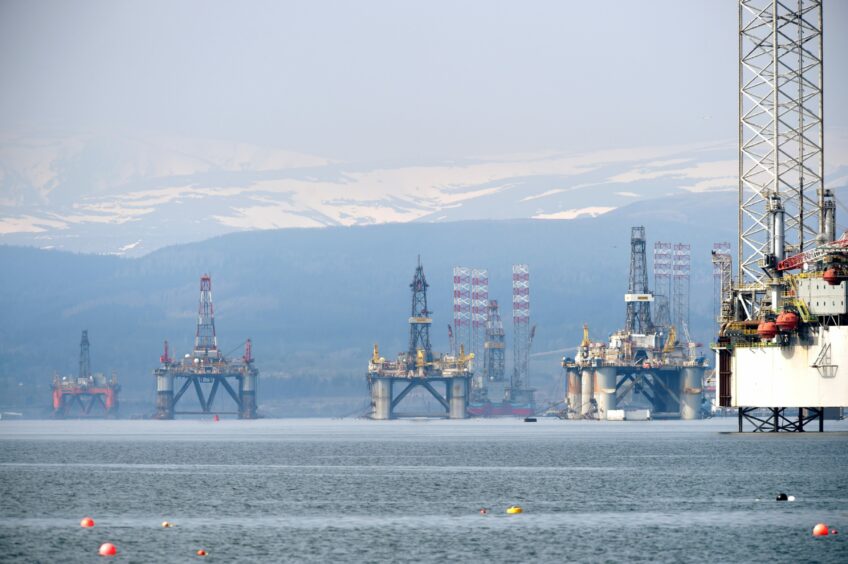 Oil rigs stacked in the Cromarty Firth.