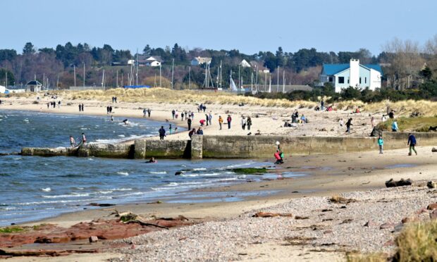 Nairn beach, with people on it.
