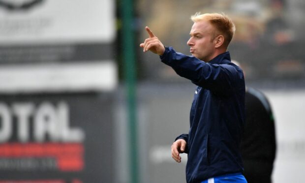 Peterhead co-manager Jordon Brown dishes out instructions from the touchline
