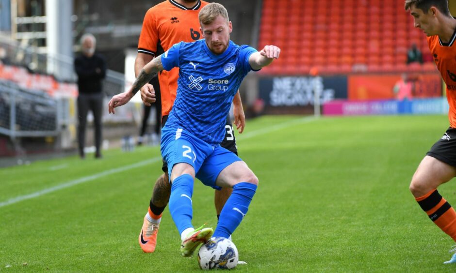 Conner Duthie in action for Peterhead against Dundee United in the Viaplay Cup.