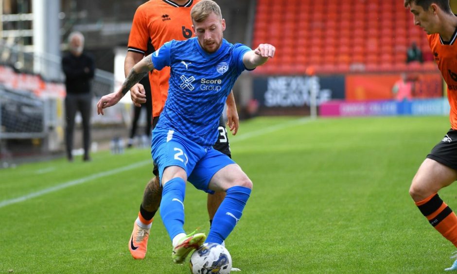Conner Duthie in action for Peterhead against Dundee United in the Viaplay Cup.