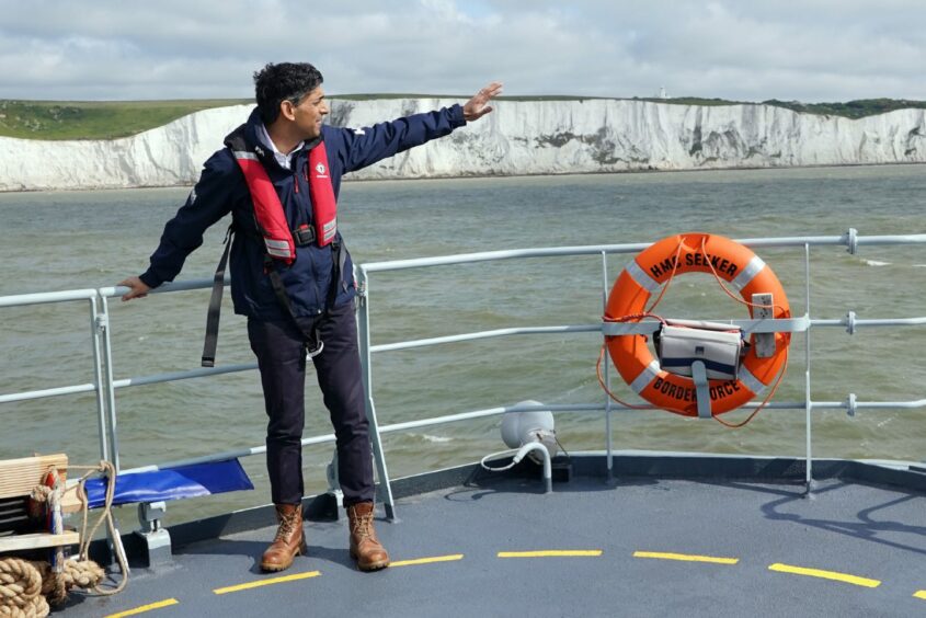 Prime Minister Rishi Sunak onboard Border Agency cutter HMC Seeker during a visit to Dover in June. Image: Yui Mok/PA Wire