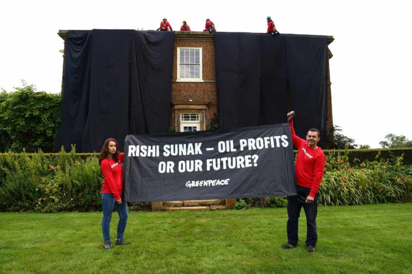Greenpeace protestors scaled Rishi Sunak's country pad in North Yorkshire and draped it in black fabric in a protest over oil.
