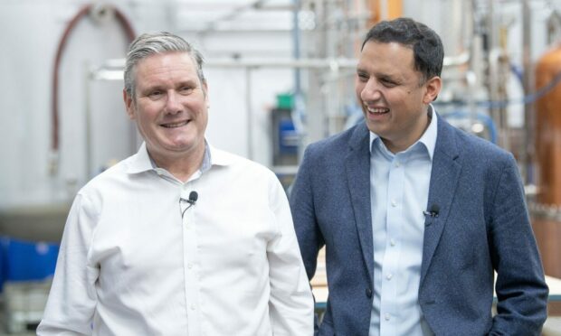 Labour leader Sir Keir Starmer (left) and Scottish Labour leader Anas Sarwar during a visit to the Lind and Lime distillery in Leith, Edinburgh. Image: PA.